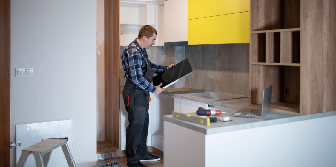 A Technician Installs a New Induction Cooktop